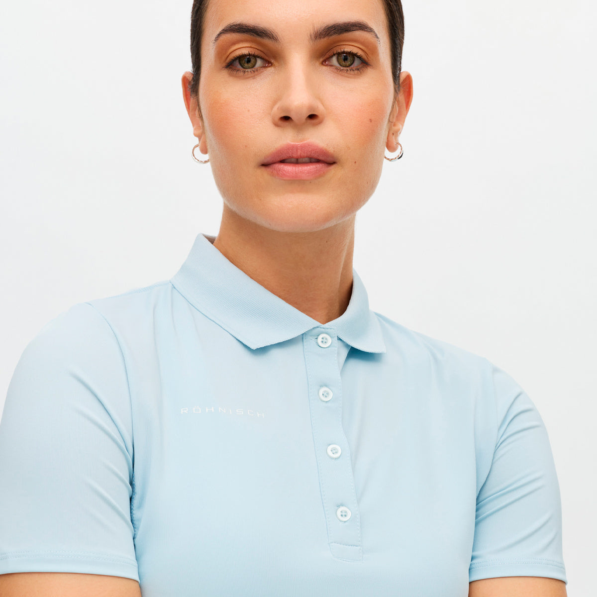 Röhnisch Nicky polo for women in soft fabric, featuring a classic collar and stylish design, perfect for casual wear.