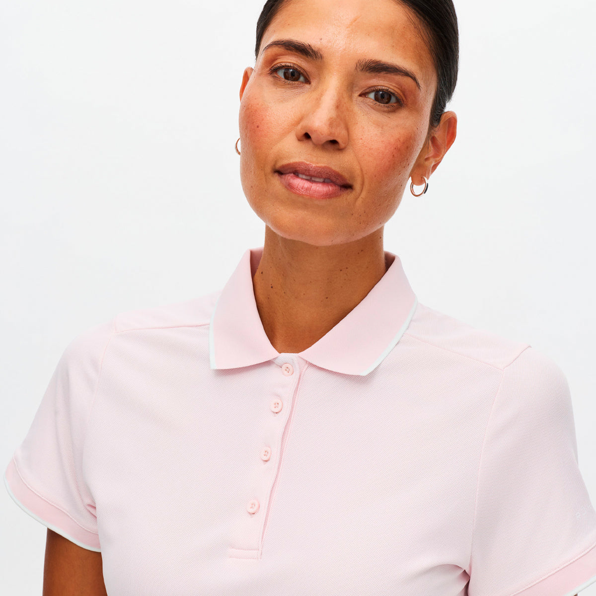 Röhnisch Miriam polo for women, featuring a stylish design and breathable fabric in a vibrant color.
