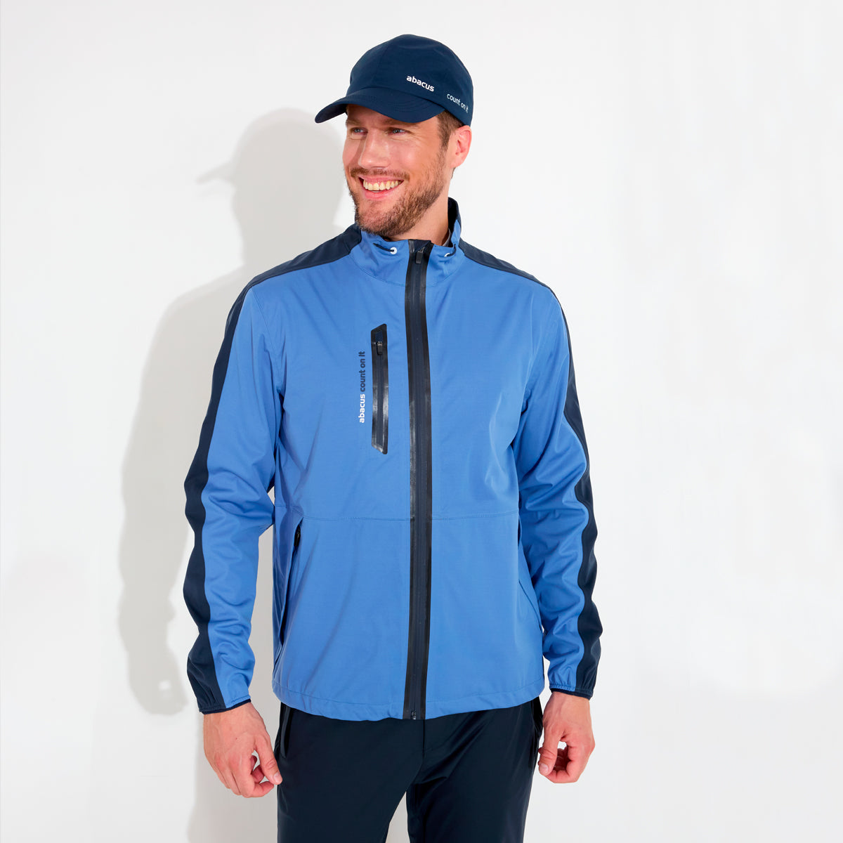 Abacus Bounce men's rain jacket in vibrant color, featuring a hood and waterproof design, perfect for outdoor activities.
