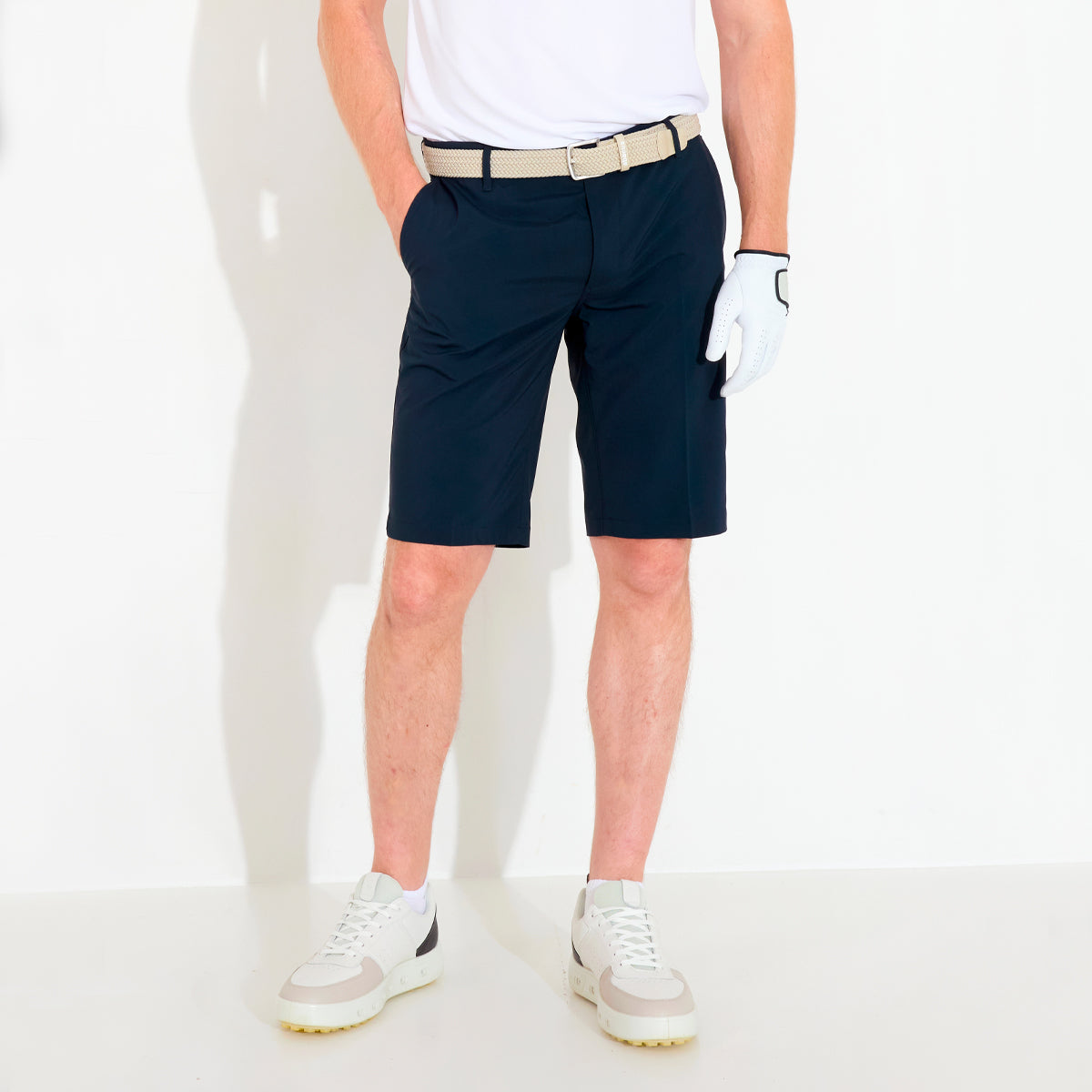 Abacus Cleek Flex shorts for men, featuring a lightweight design and flexible fabric in a stylish outdoor setting.