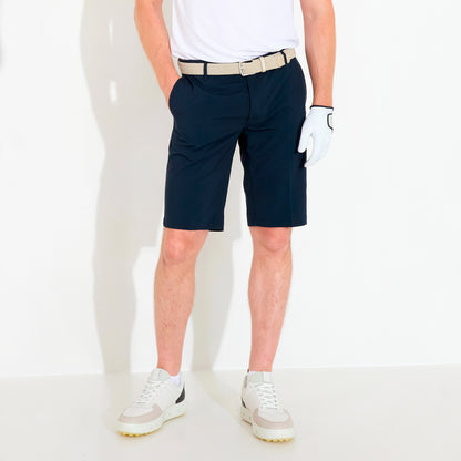 Abacus Cleek Flex shorts for men, featuring a lightweight design and flexible fabric in a stylish outdoor setting.